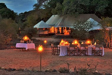 An al fresco dinner prepared at Hamiltons Tented Camp in the Kruger National Park.