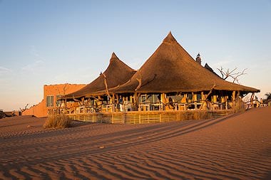 Little Kulala Lodge emerges from the sands of the Namib Desert.