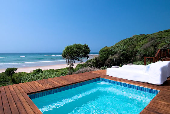 Plunge pool and sunbed on a private villa terrace facing the beach at White Pearl Resort in Mozambique.