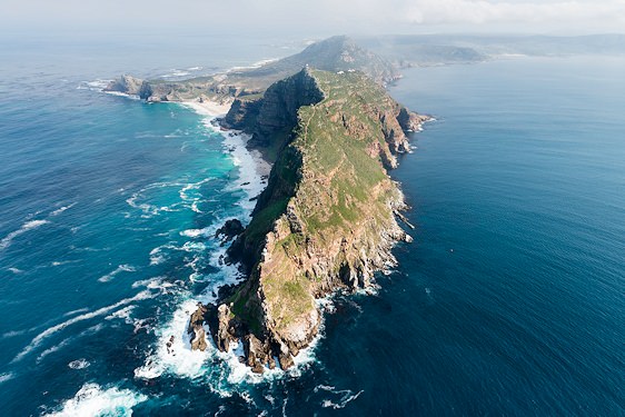 A sign indicating the longitude and latitude of Cape Point.