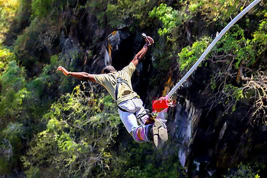 A bungee jumper leaping off a bridge.