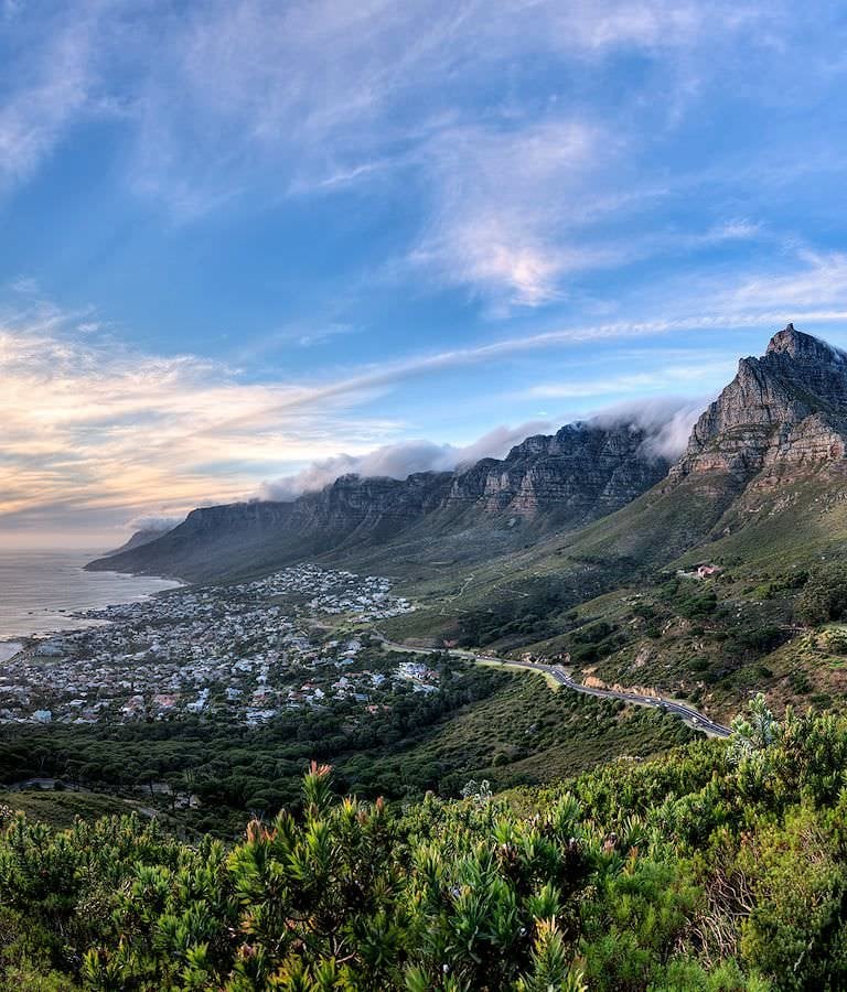 A road winds below the Twelve Apostles in South Africa.