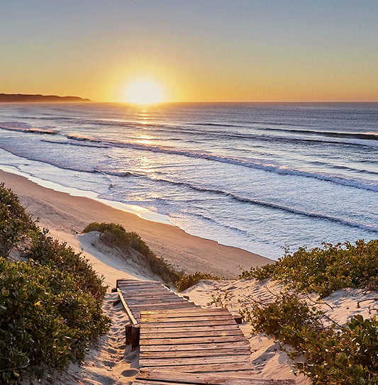 A spectacular sunrise along the Wild Coast coastline at Prana Lodge.