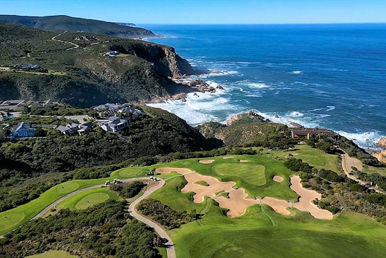 Birds-eye view of Pezula Golf Course greens and sand bunkers on cliffs above the ocean in Knysna.