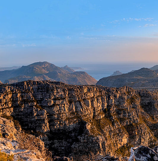 A panoramic view of the rugged Cape Peninsula mountains and coastline in Cape Town, South Africa.