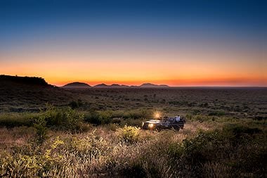 Sunset game drive in a malaria-free conservation area.