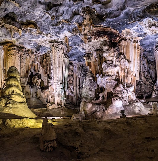 Massive stalactites and stalagmites inside a cavern at the Cango Caves in Oudthoorn.