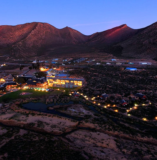 An aerial view of Aquila Private Game Reserve, surrounded by mountains in the Little Karoo, South Africa.