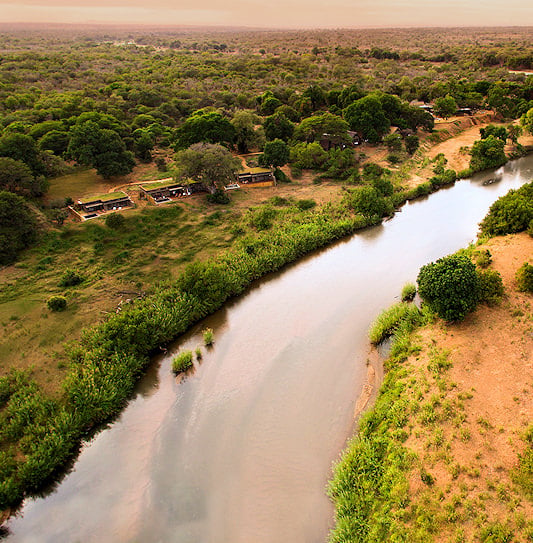 An aerial view of Lion Sands River Lodge next to the Sabie River in Sabi Sand Private Game Reserve, South Africa.