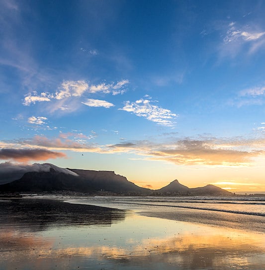 A view of Table Mountain in Cape Town at sunset, taken from the north side of the bay.