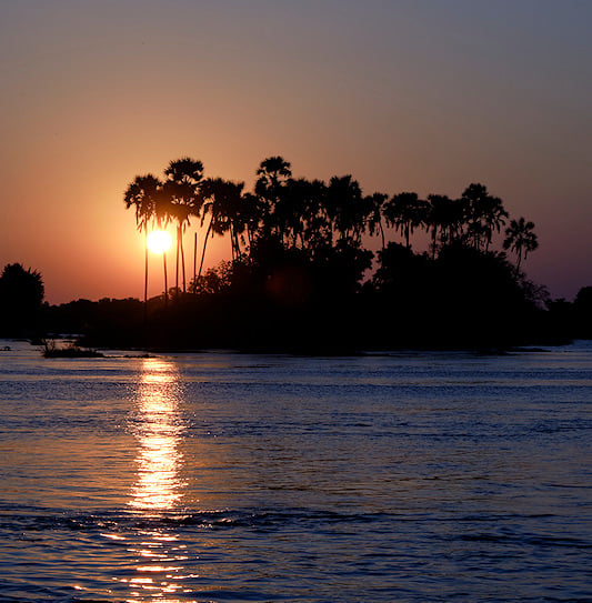 The Zambezi River at sunset near Victoria Falls, Zimbabwe.