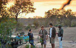 Guests enjoy a mid-safari sundowner at Djuma in the Sabi Sand.