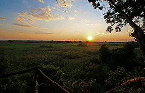 The sun sets over the Kasanka National Park.