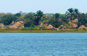 Thatched traditional buildings along the shores of Lake Mweru.